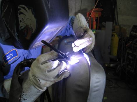 6. Heli-arc welding the tank
