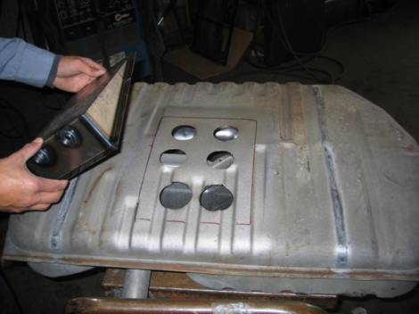 12. This is a gas tank being modified. We are installing a sump that is used for racing. We can also modify fuel tanks for fuel injection vehicles by installing the fuel pump in the tank.